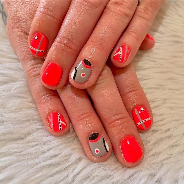 Red and grey abstract graphic nail art