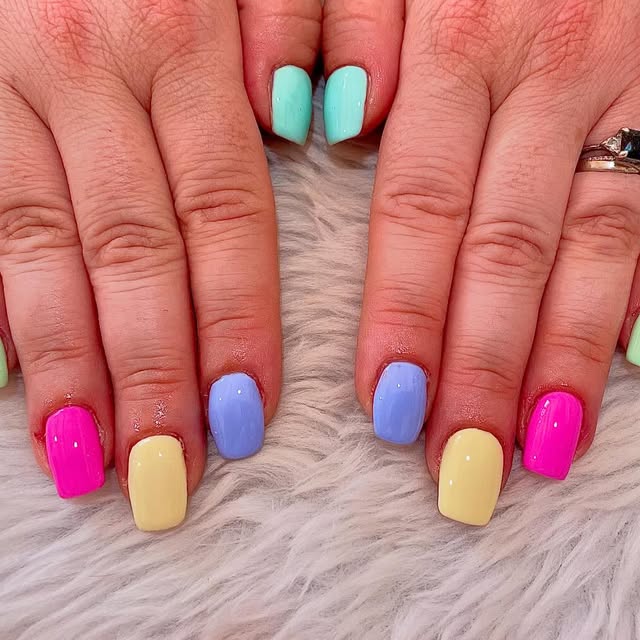 Pastel rainbow nails in mint, pink, yellow and lilac