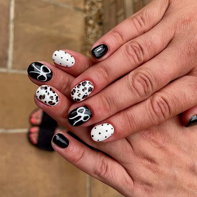 Black and white leopard print and polka dot nails