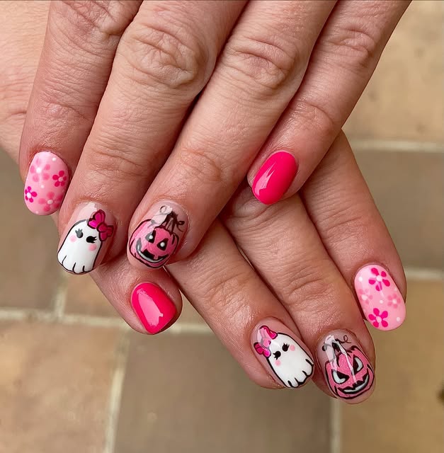 Pink Halloween nails with a cute ghost and pumpkin