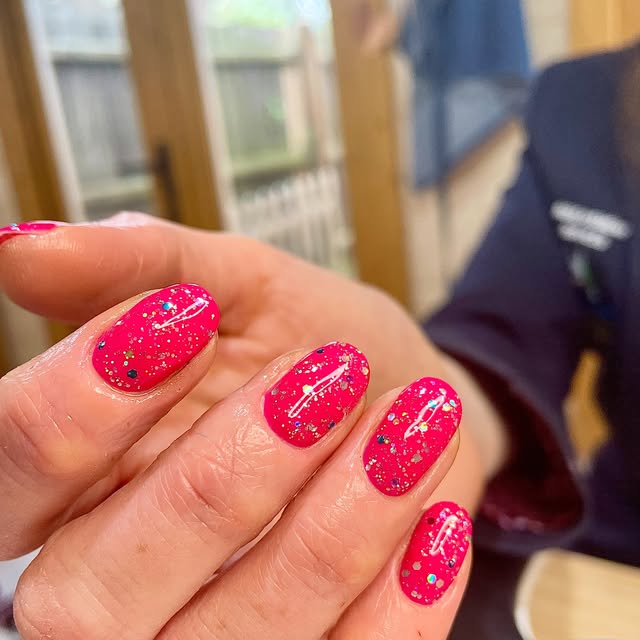 Hot pink glitter splatter nails