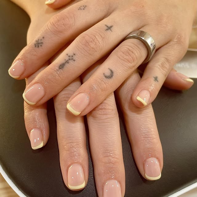 Nude nails with a fine gold french tip